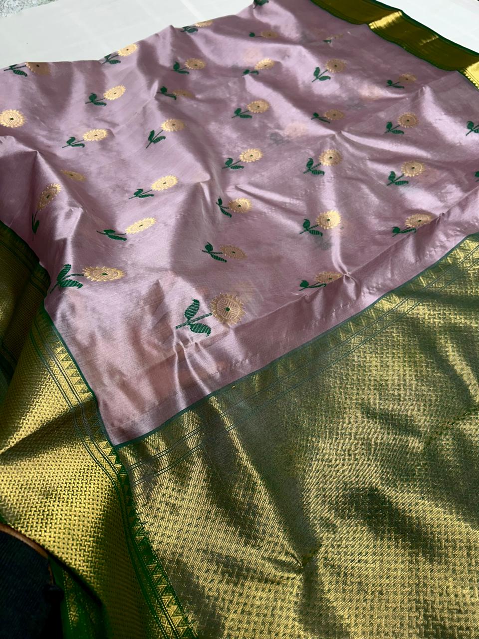 Pastel pink pattu silk saree with meena work nakshi border