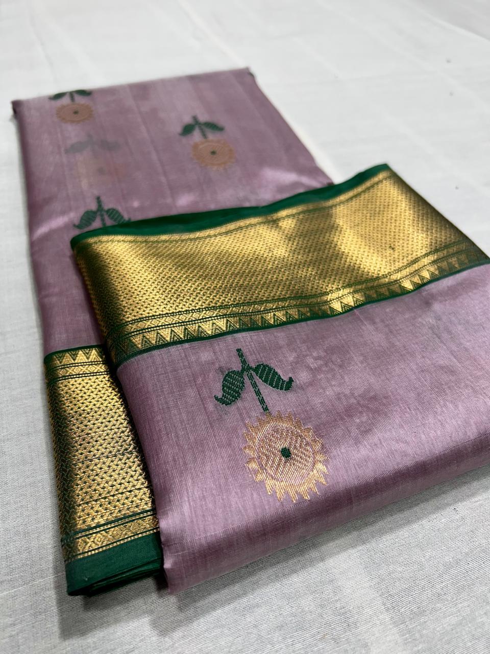 Pastel pink pattu silk saree with meena work nakshi border