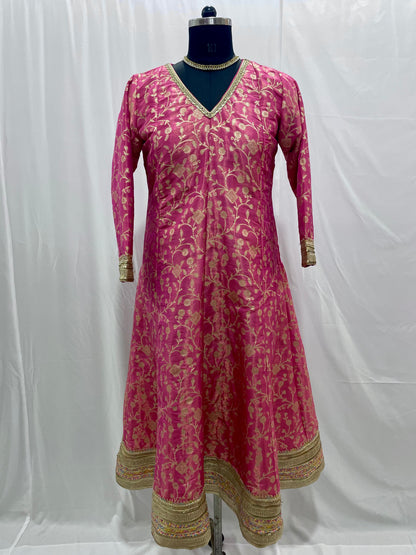 Pink anarkali salwar kameez suit designed with embroidered tissue fabric