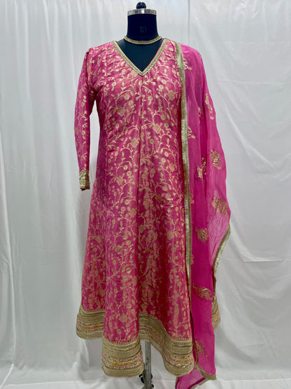 Pink anarkali salwar kameez suit designed with embroidered tissue fabric