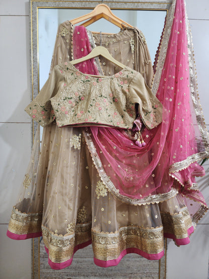 Indian designer golden lehenga with pink dupatta