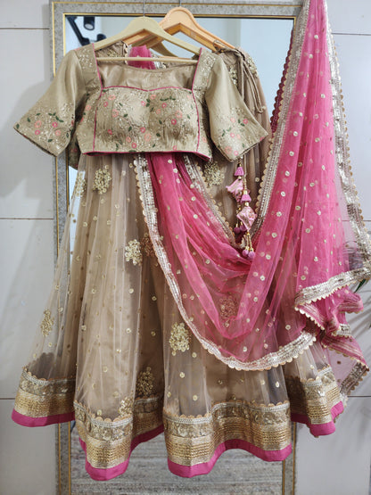 Indian designer golden lehenga with pink dupatta