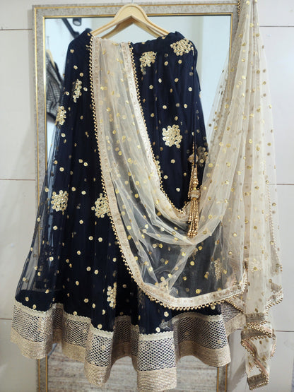 Embroidered black lehenga with golden dupatta