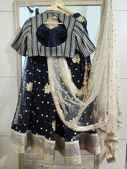 Embroidered black lehenga with golden dupatta