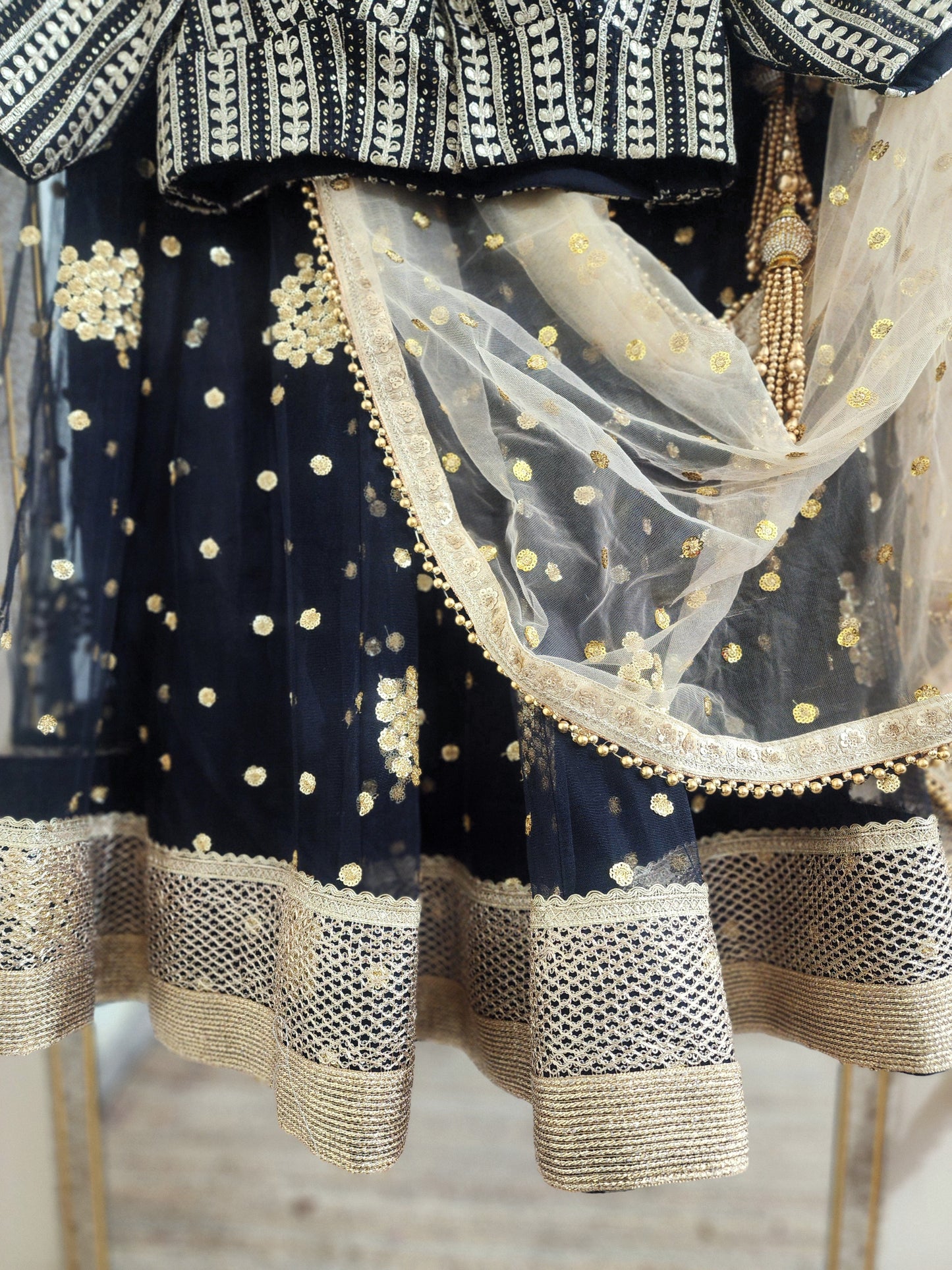 Embroidered black lehenga with golden dupatta