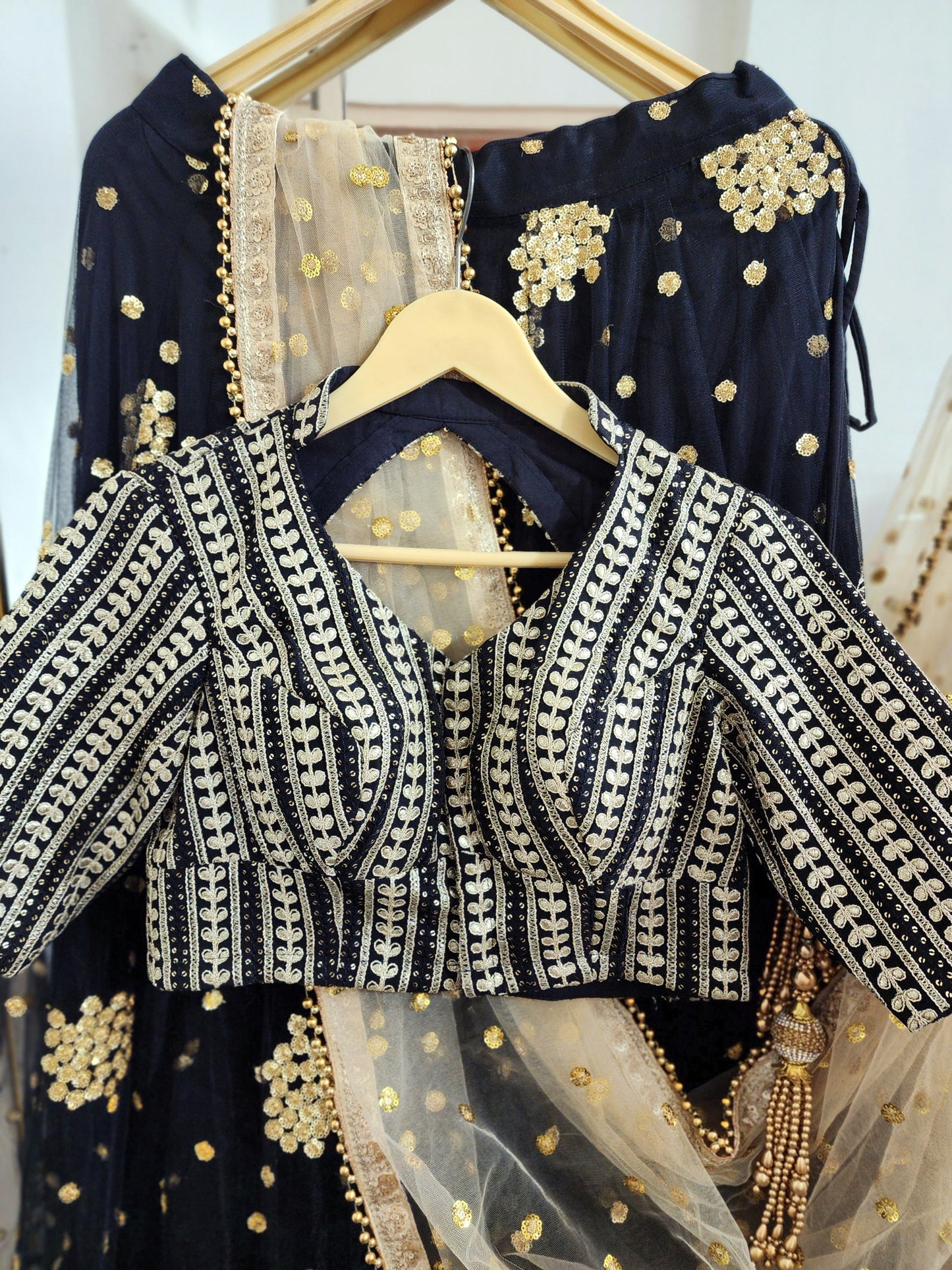 Embroidered black lehenga with golden dupatta