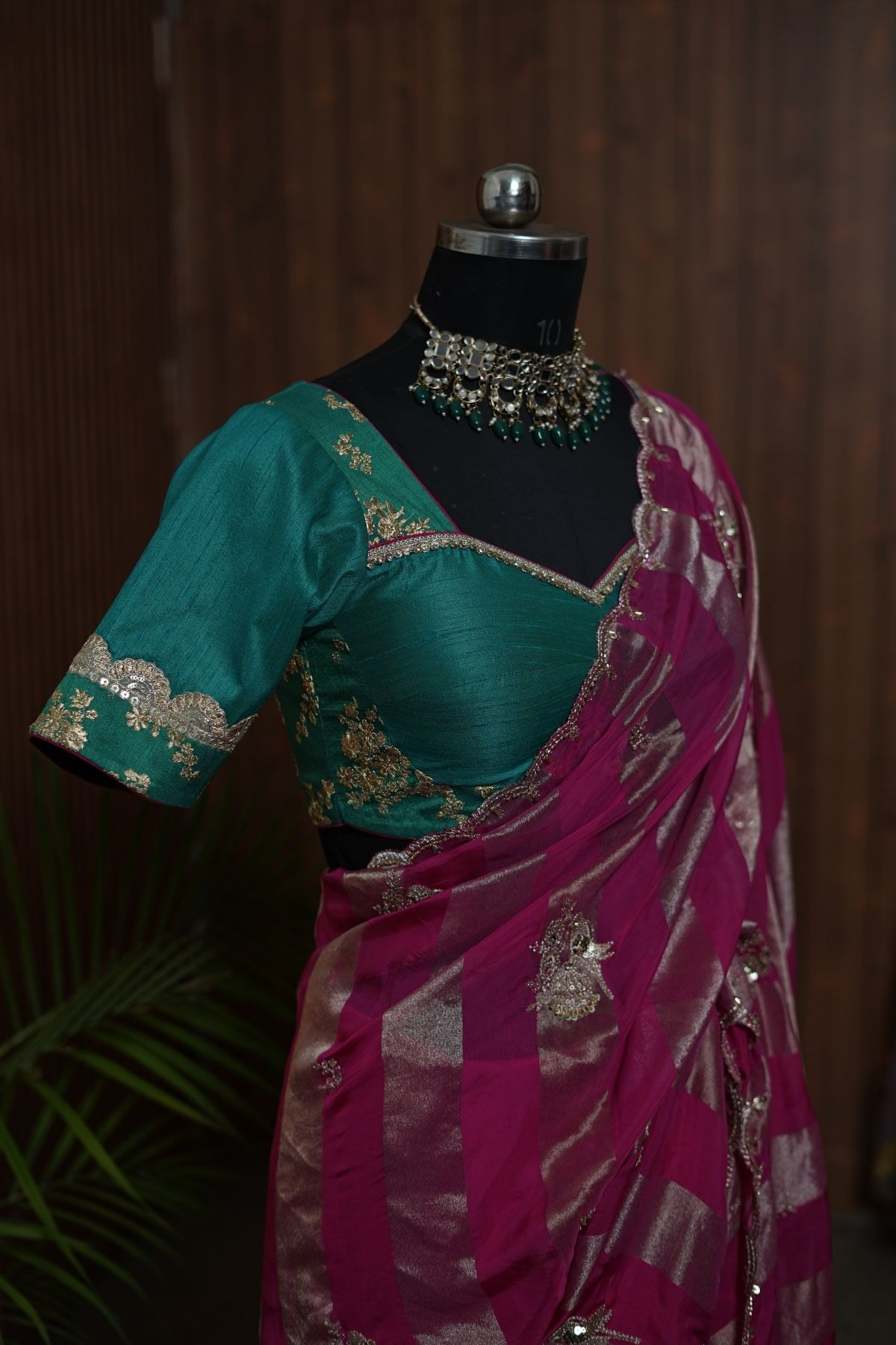 Full front view of magenta dual-texture saree with metallic stripes and embellished border