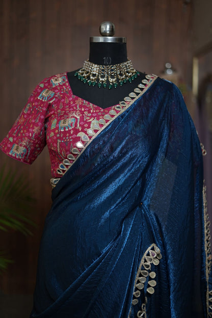 Full front view of navy blue saree with gold-toned border and pink blouse