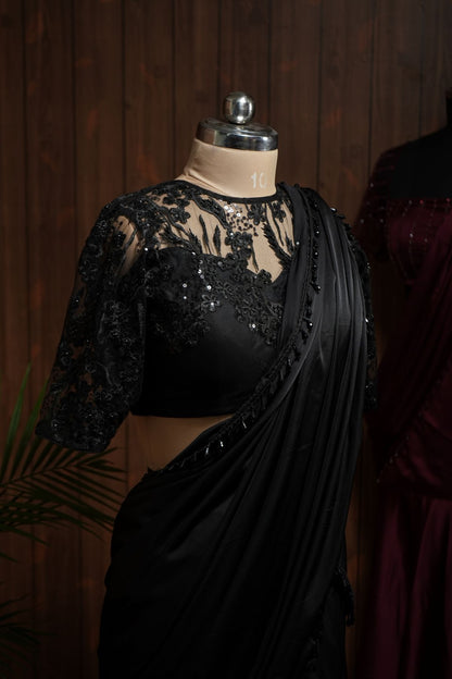 Back view of black sequin embroidered net blouse with keyhole back and tie-up
