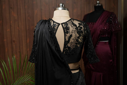 Full back view of black saree with sequin embroidered net blouse