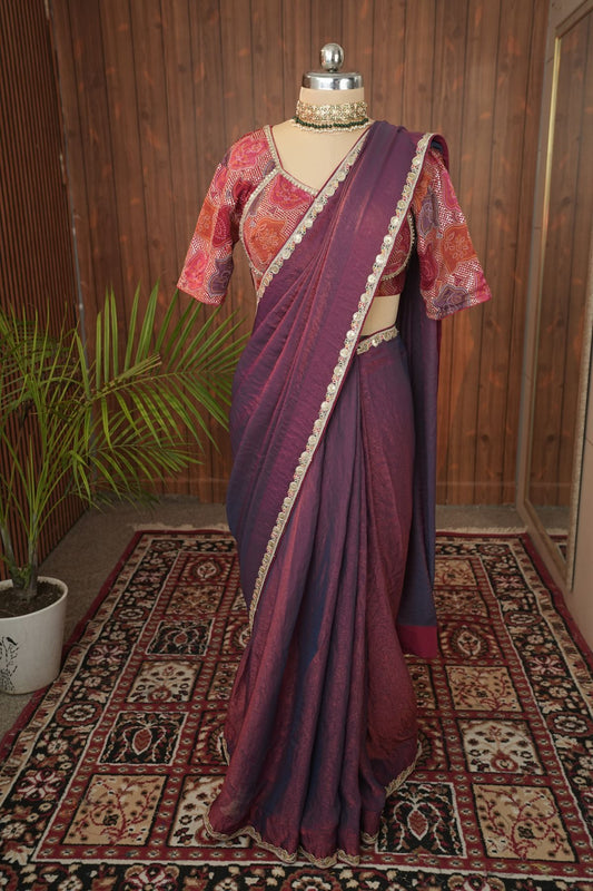 Close front view of plum saree and multicoloured V-neck blouse