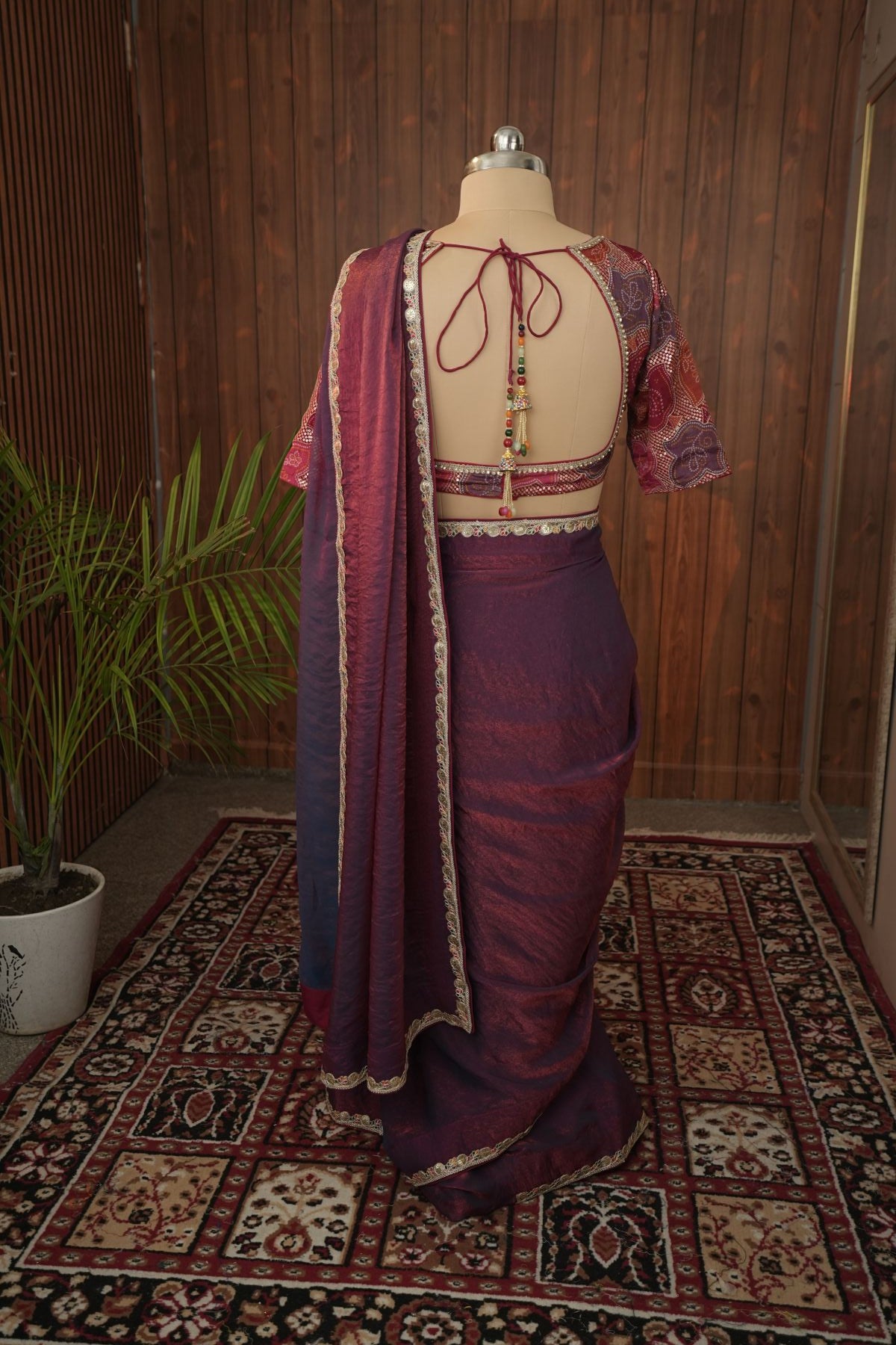 Side detail of plum saree border and patterned blouse