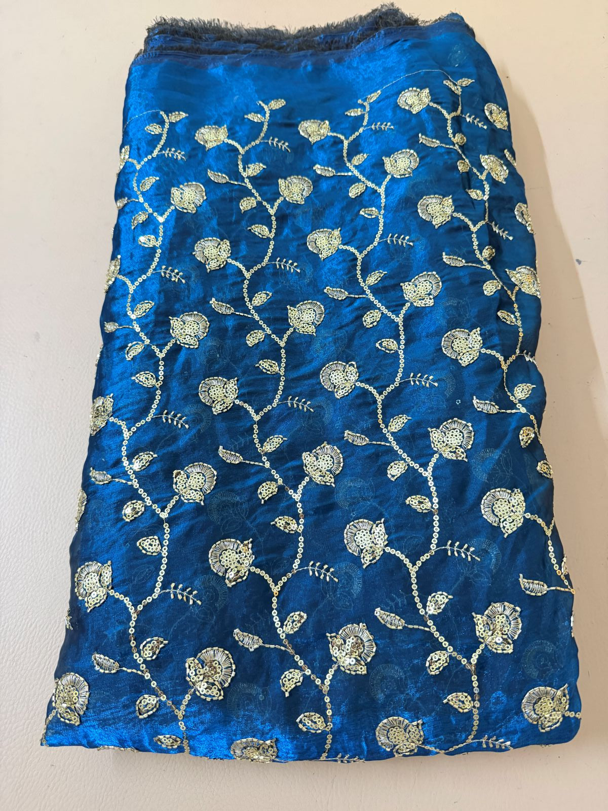Royal blue lehenga skirt close-up showing floral sequin work