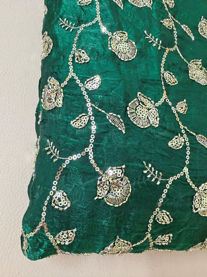 Teal green lehenga skirt laid flat showing all-over shimmer work and full flare