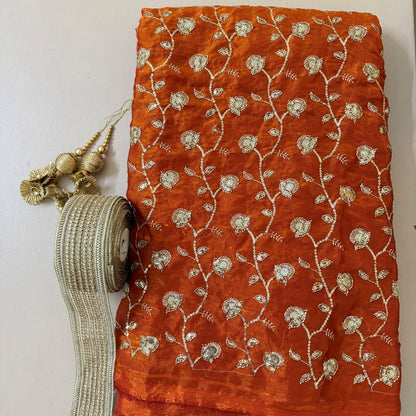 Folded lehenga fabric with gota patti lace and gold latkans