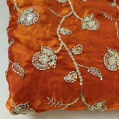 Detail of gold sequin and zari floral embroidery