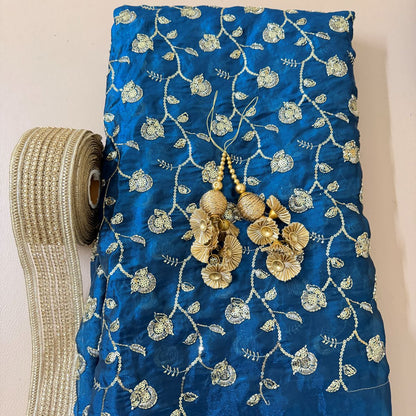 Royal blue floral sequin lehenga skirt with gold border and decorative tassels
