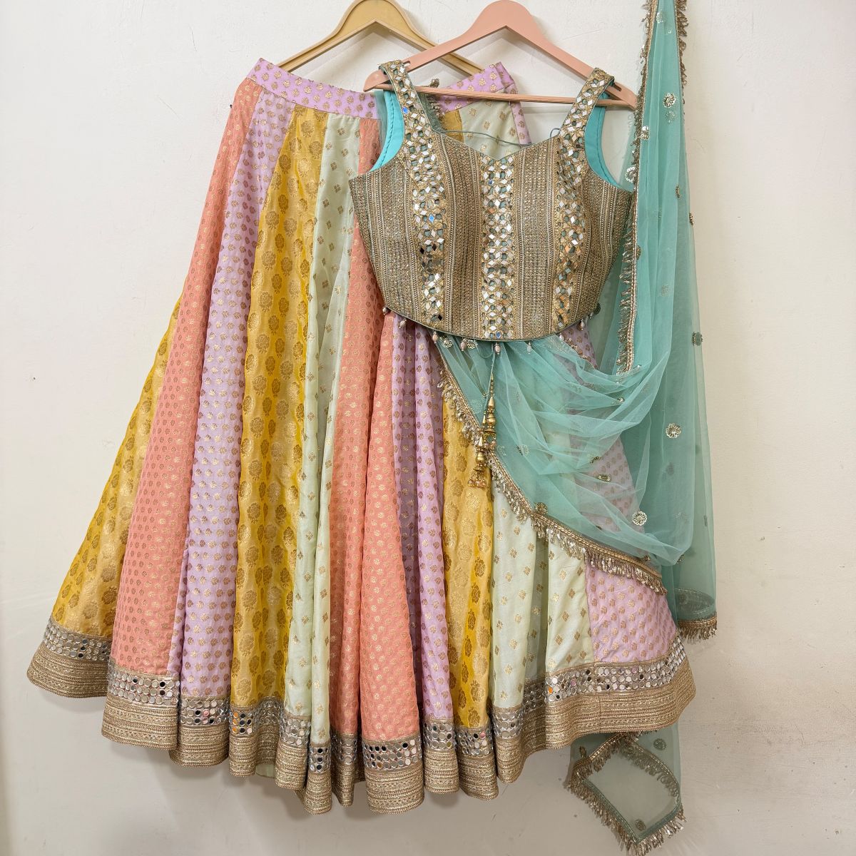 Pastel multicolour panelled lehenga with mirror-work blouse and sheer aqua dupatta