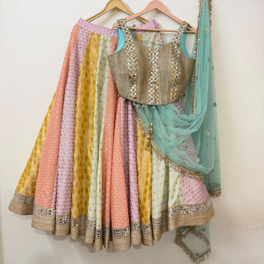Pastel multicolour panelled lehenga with mirror-work blouse and sheer aqua dupatta