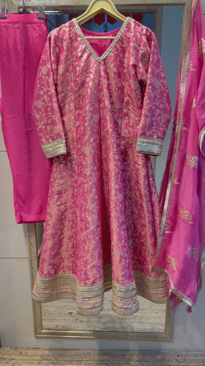 Pink anarkali salwar kameez suit designed with embroidered tissue fabric