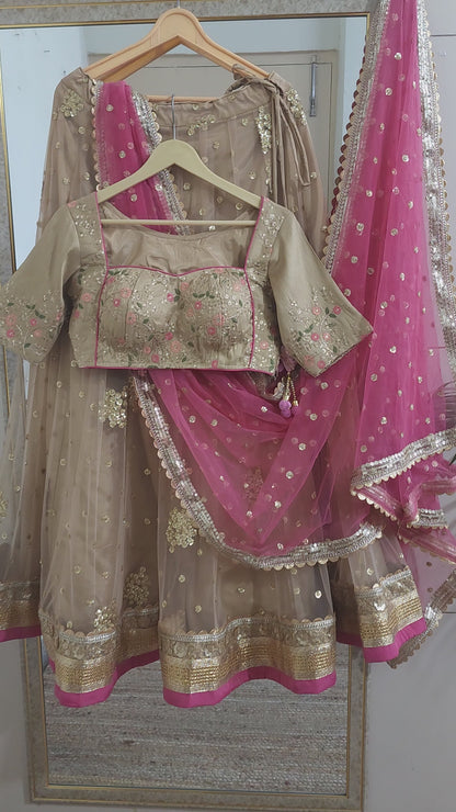 Indian designer golden lehenga with pink dupatta